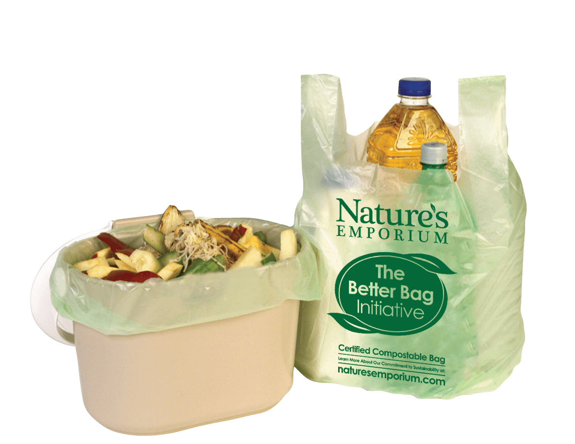 The new Nature's Emporium 100% compostable bag holding groceries and lining a compost bin